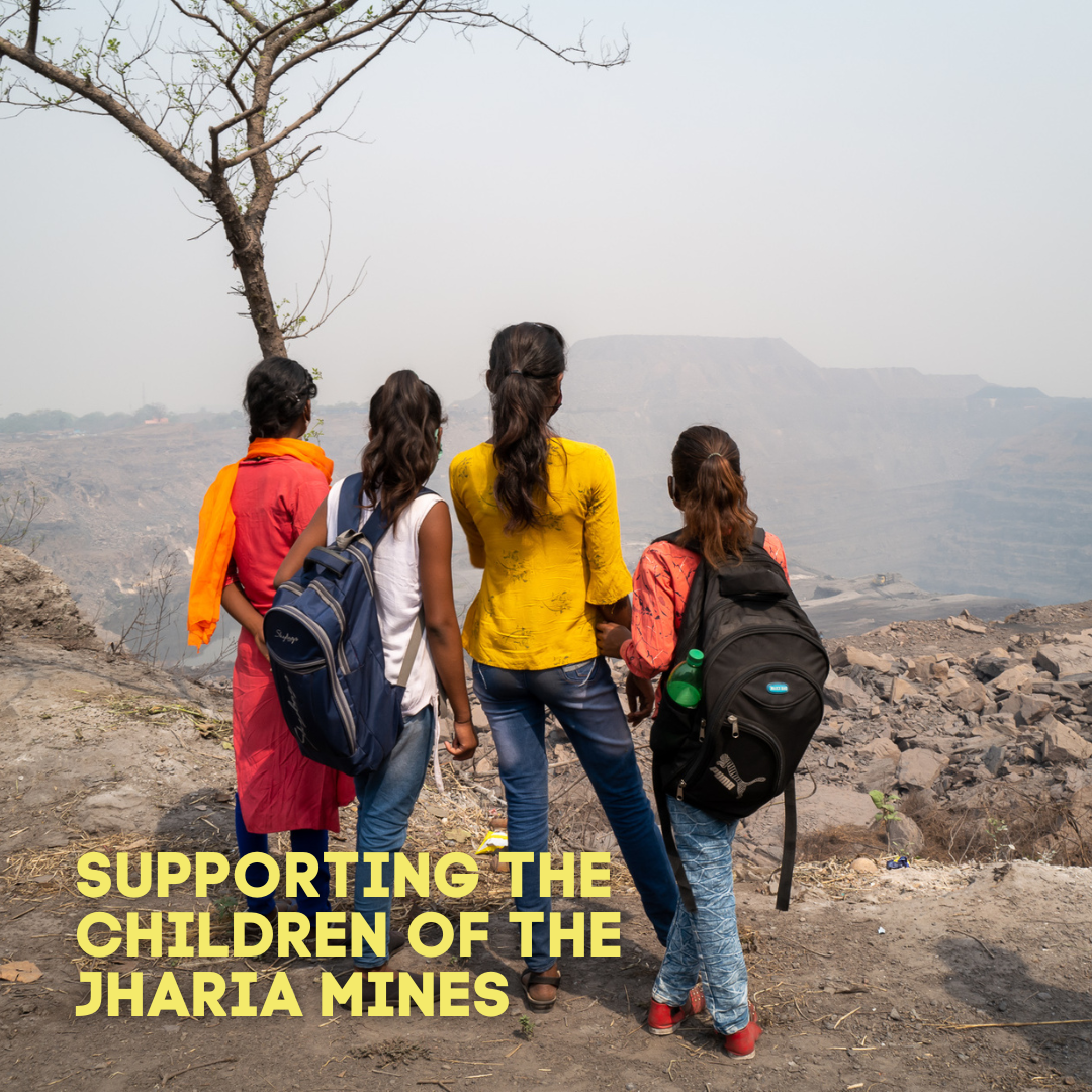 Four children from the Jharia mine looking out over the landscape 